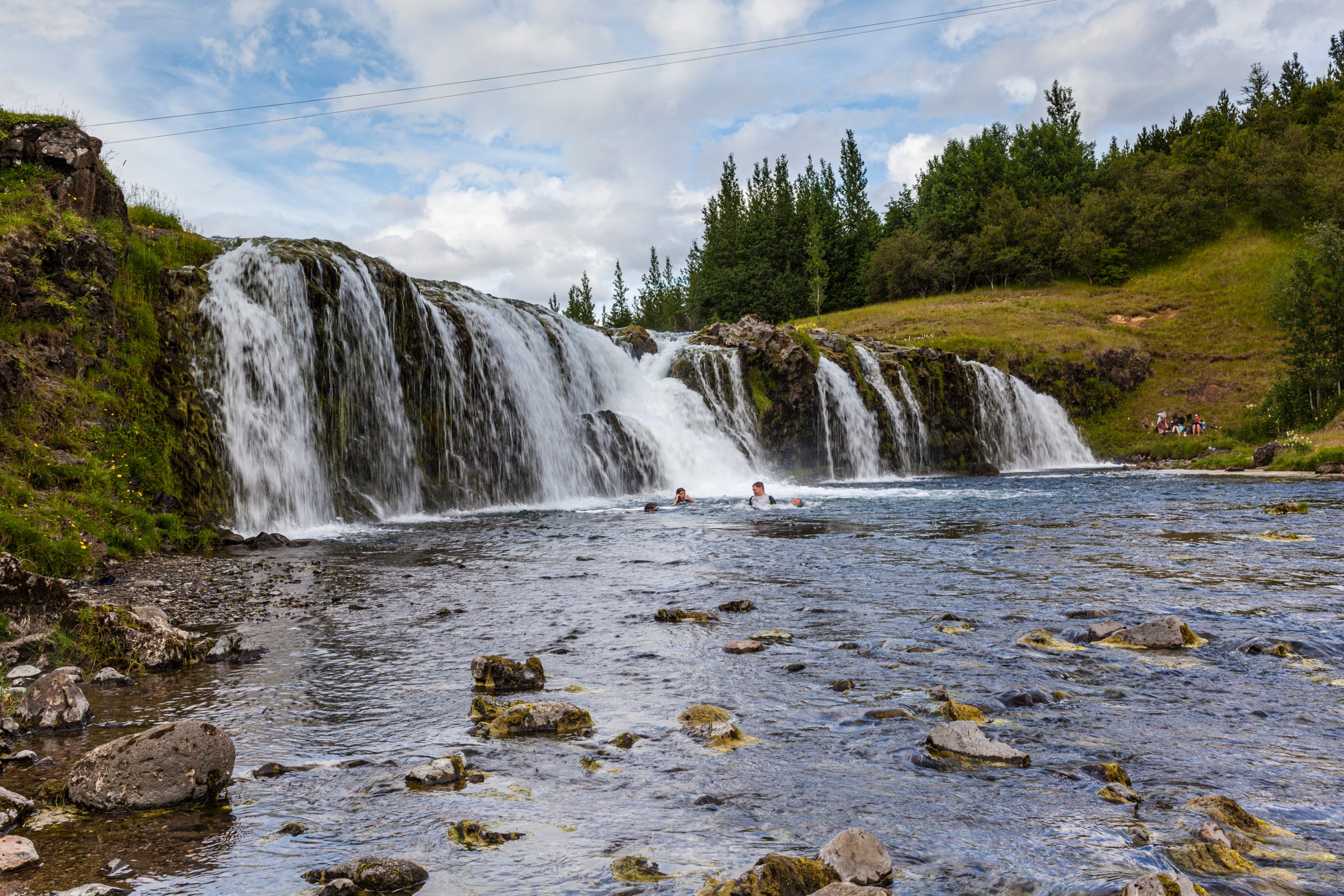 Reykjafoss with people bathing